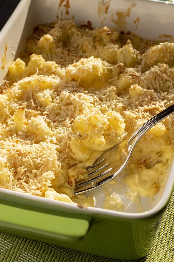 Cauliflower and Cheese Gratin in Green Ceramic Baking Form with Fork