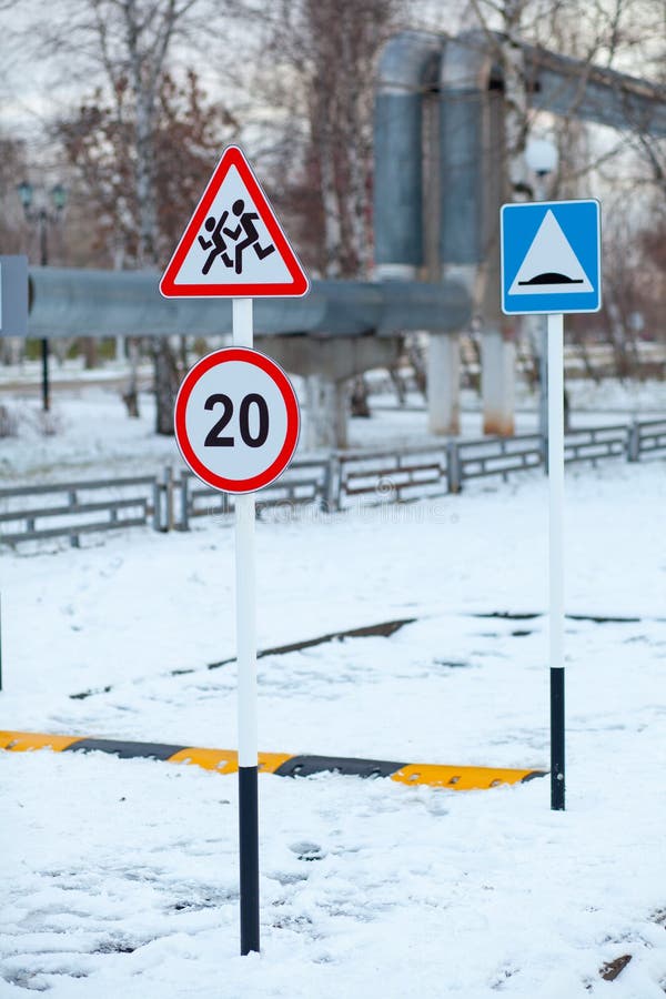 Caution sign children on the Playground in winter stock photo