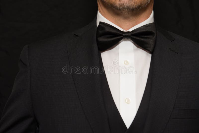 Close-up of a gentleman wearing Black Tie. Close-up of a gentleman wearing Black Tie.