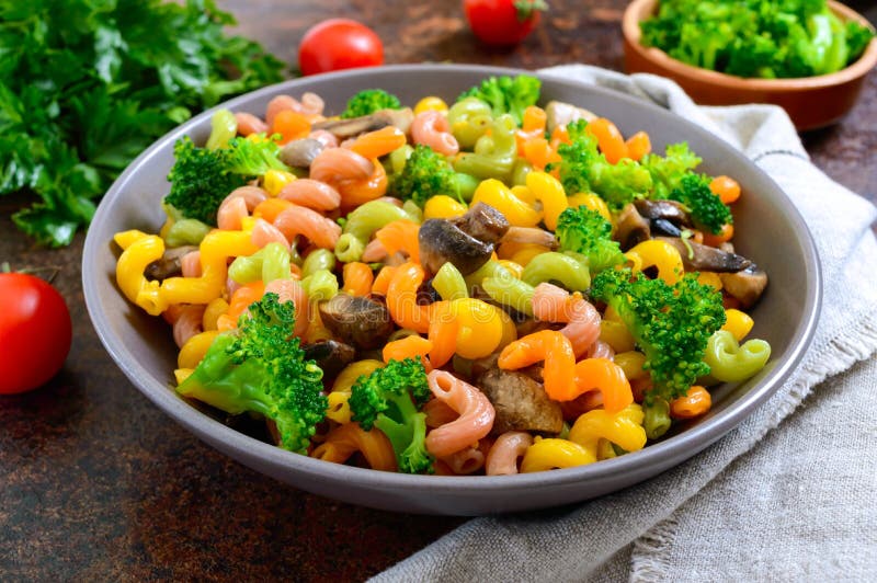 Cavatappi Colored Pasta with Broccoli and Mushrooms. Pasta Colorata