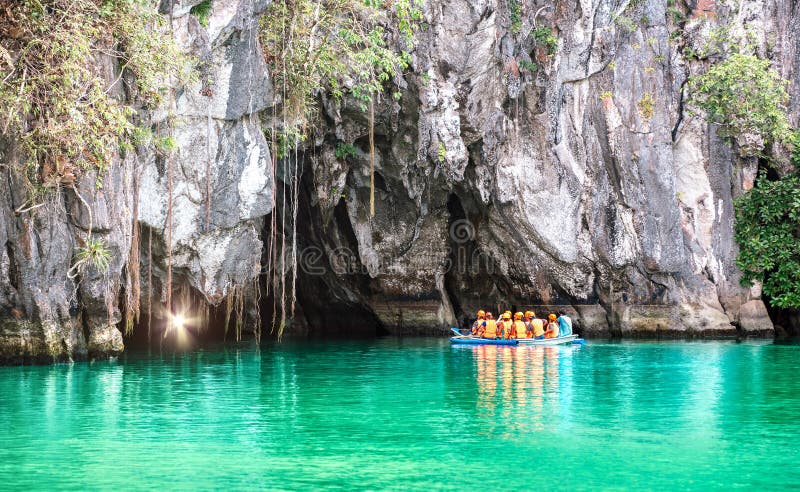 Cave entrance of Puerto Princesa subterranean underground river with longtail boat - Wanderlust travel concept at Palawan