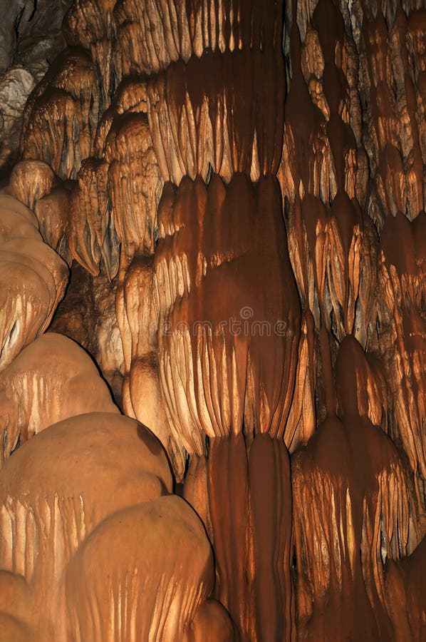 Cave interior with water dripping down the wall that looks like chocolate. Photo taken inside of Moaning Cavern, California. Cave interior with water dripping down the wall that looks like chocolate. Photo taken inside of Moaning Cavern, California.