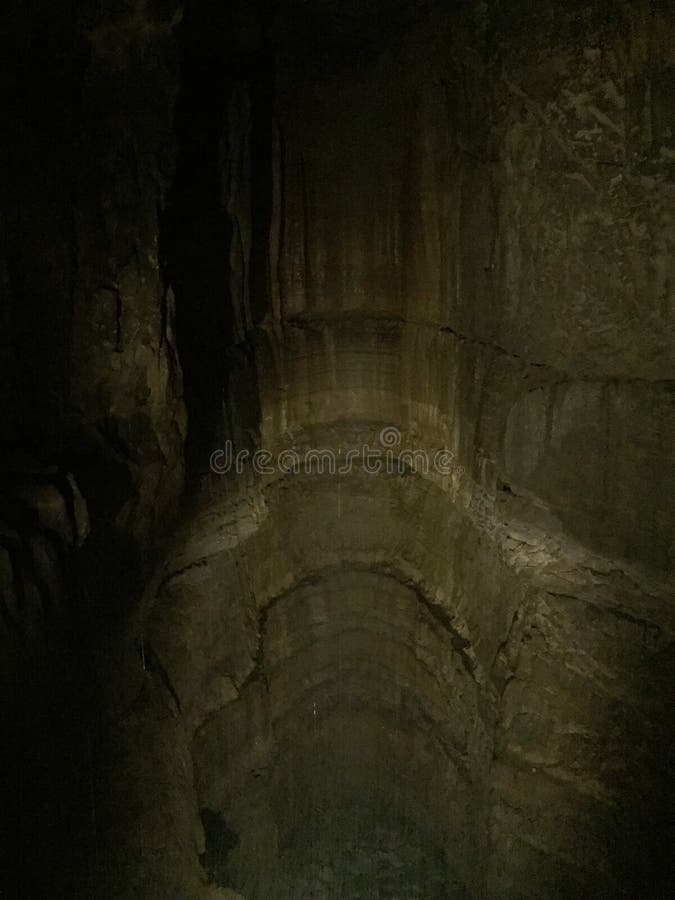Large Cave in Mammoth Cave Kentucky with Sparse Lighting and Formations