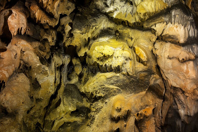 Limestone wall in a cave covered with dripstone