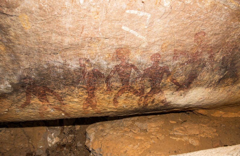 Cave paintings on the wall, painted ocher rock. prehistoric man, the primitive Neanderthal. the leader of the tribe, the shaman, pets, native. The Stone Age. These painting located in Phu Phra bat his