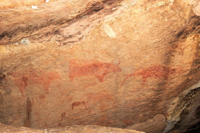 Cave paintings on the wall, painted ocher rock. prehistoric man, the primitive Neanderthal. the leader of the tribe, the shaman, pets, native. The Stone Age. These painting located in Phu Phra bat his