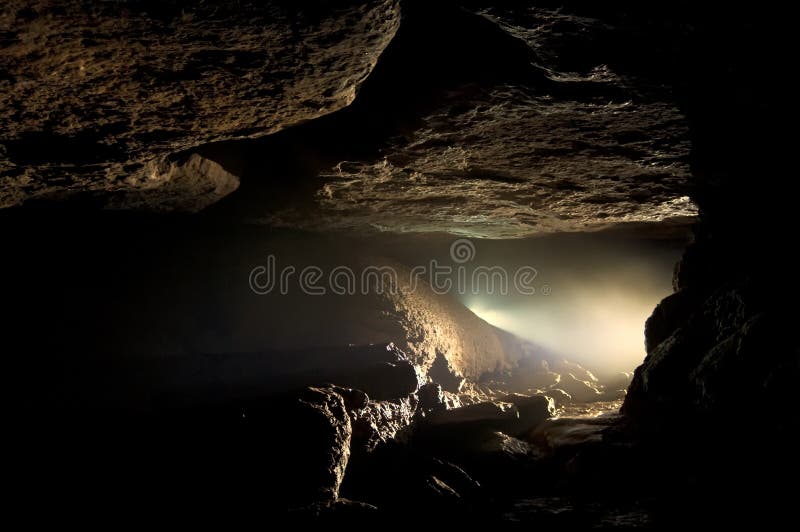 Dark cave with light and fog. Dark cave with light and fog