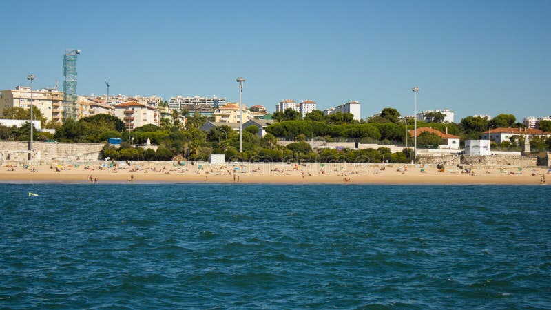 View of Caxias beach and village from Tagus (Tejo). Caxias was once a very popular beach for Lisbon (Lisboa) people on the coast between Lisboa, Estoril and Cascais. It is nowadays a vintage beach recovering its prestige. View of Caxias beach and village from Tagus (Tejo). Caxias was once a very popular beach for Lisbon (Lisboa) people on the coast between Lisboa, Estoril and Cascais. It is nowadays a vintage beach recovering its prestige