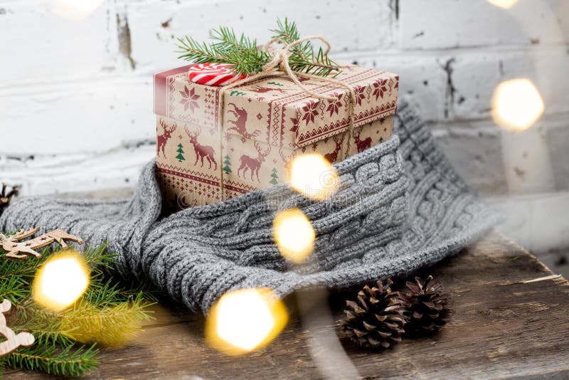 CChristmas tree with a gift box and decorations on a brick background stock photo CChristmas tree with a gift box and decorations on a brick background stock photo
