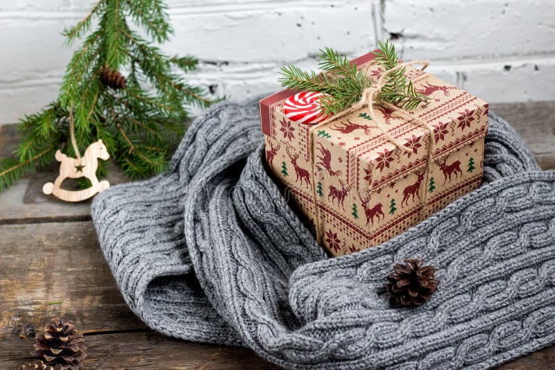 CChristmas tree with a gift box and decorations on a brick background stock image CChristmas tree with a gift box and decorations on a brick background stock image