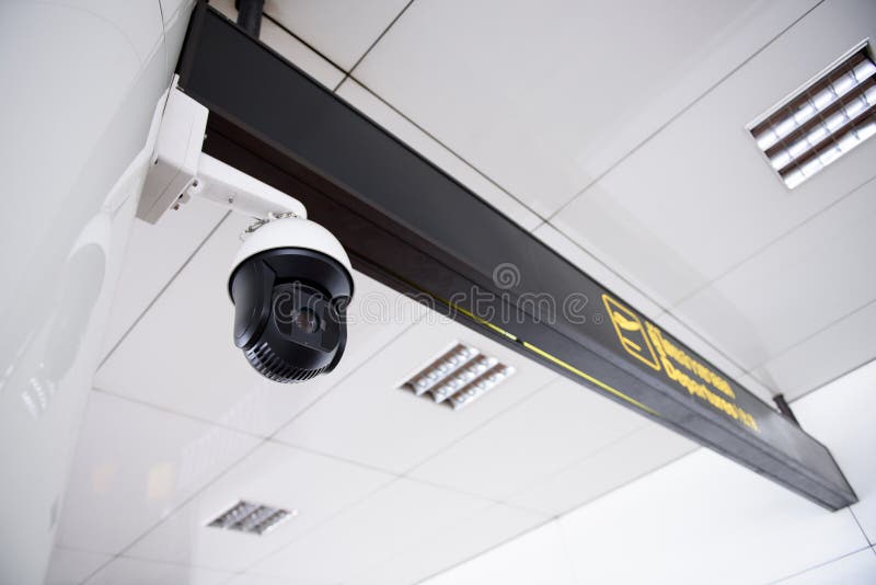CCTV Camera Hanging on the Roof. Stock Photo Image of roof, observe