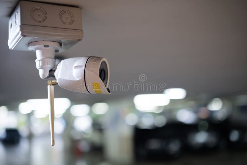 CCTV Camera Security in Parking Garage in the Mall for Background Stock