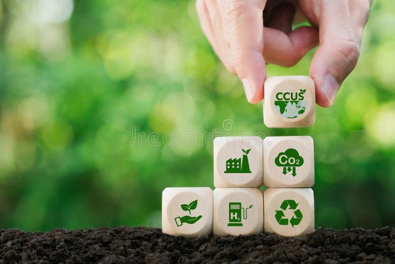 CCUS, Carbon Capture, Utilization and Storage concept. Hand holding wood block with CCUS word and icon. Technology of CO2 capturing royalty free illustration