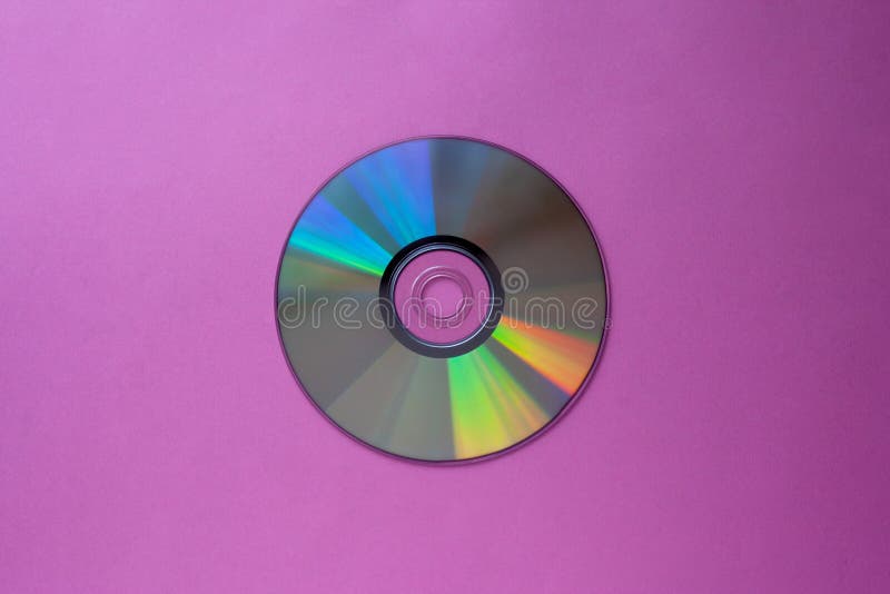 CD Cd σε μια πορφυρός-ιώδη τοπ άποψη υποβάθρου με το διάστημα αντιγράφων στοκ φωτογραφία με δικαίωμα ελεύθερης χρήσης CD Cd σε μια πορφυρός-ιώδη τοπ άποψη υποβάθρου με το διάστημα αντιγράφων στοκ φωτογραφία με δικαίωμα ελεύθερης χρήσης