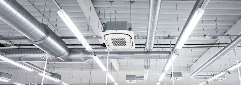 Ceiling air conditioning unit with ventilation system