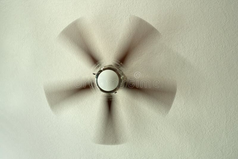 Ceiling Fan With Spinning Blades Attached To Textured