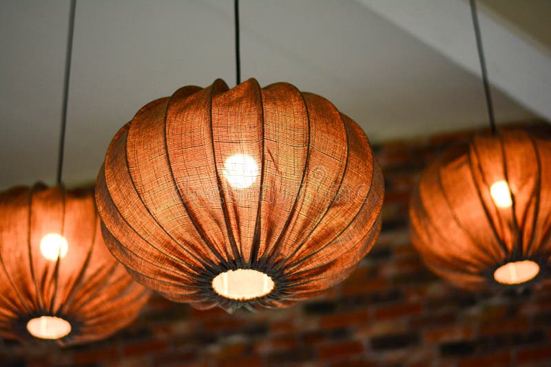 Hanging Beautiful Lanterns with Setting Against the Yellow Windows