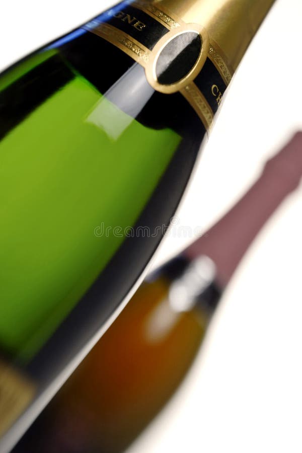 Two bottles of champagne, one white and one a pink rose,shallow depth of field . Two bottles of champagne, one white and one a pink rose,shallow depth of field .