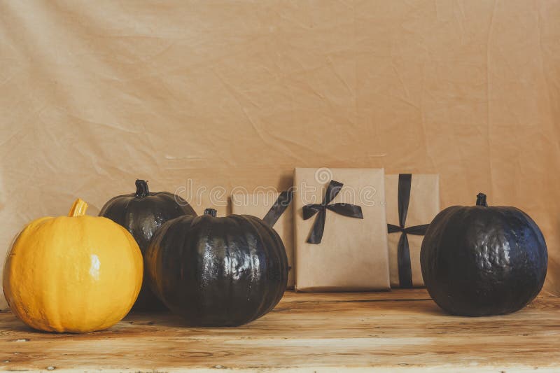 Celebrating Halloween. Orange and Black Pumpkins with Decorated Gift ...