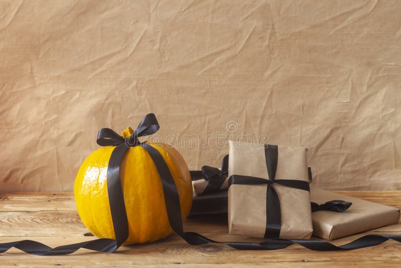 Celebrating Halloween. Orange and Black Pumpkins with Decorated Gift ...