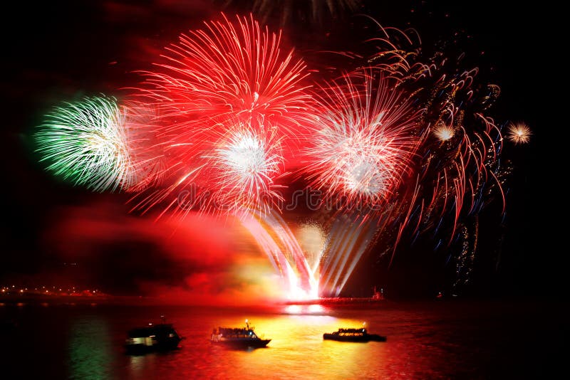 Celebration of the new year, firework over the sea royalty free stock images