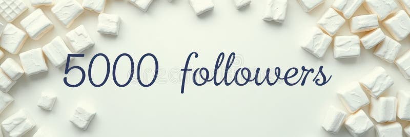 Celebration of reaching 5000 followers with a creative display of marshmallows on a light background stock photography