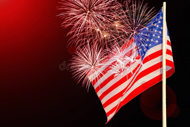 Celebratory fireworks on the background of the US flag