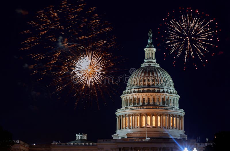 Celebratory fireworks of Independence day United States Capitol building in Washington DC, on the background