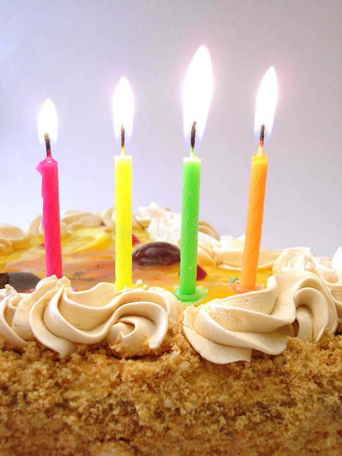 Celebratory table (birthday cake and colored candles)