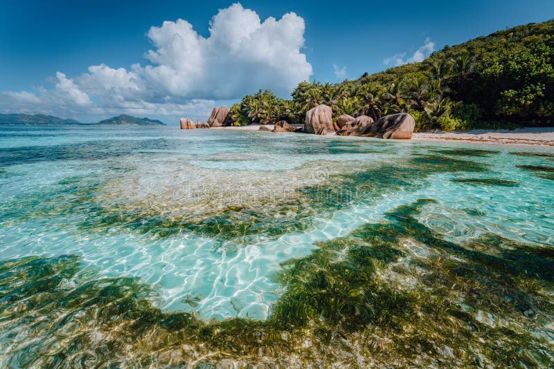 Famous tropical beach Anse Source d&#x27;Argent with granite boulders, La Digue Island, Seychelles. Famous tropical beach Anse Source d&#x27;Argent with granite boulders, La Digue Island, Seychelles.