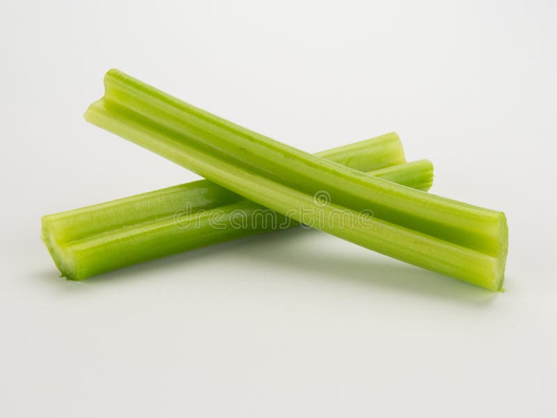 celery-stalks-white-stalk-cut-two-isolated-background-82799540.jpg