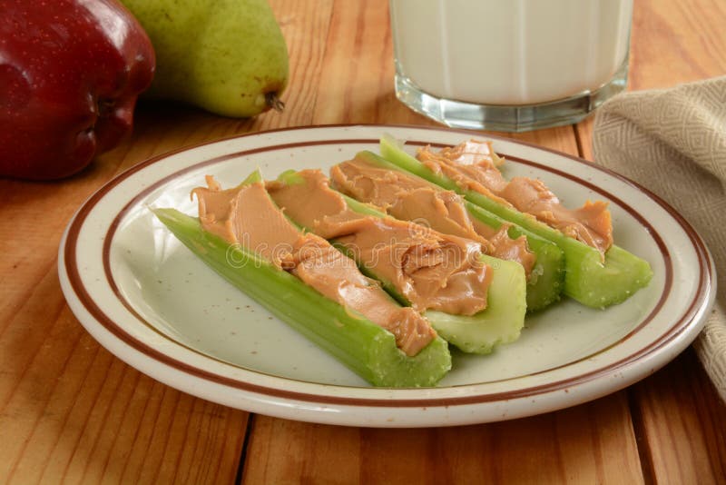 Celery sticks and peanut butter stock photos