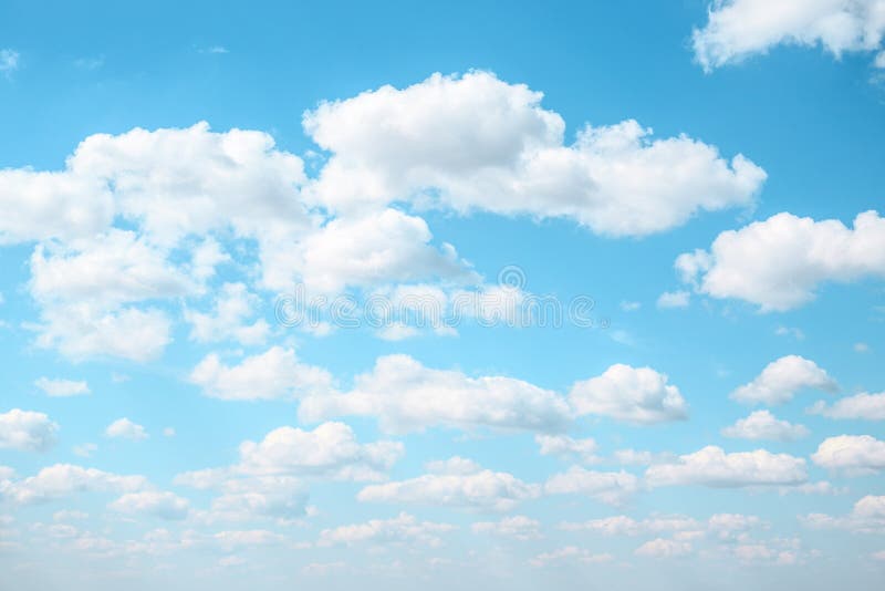 Celestial Azure background fluffy clouds in the light blue sky