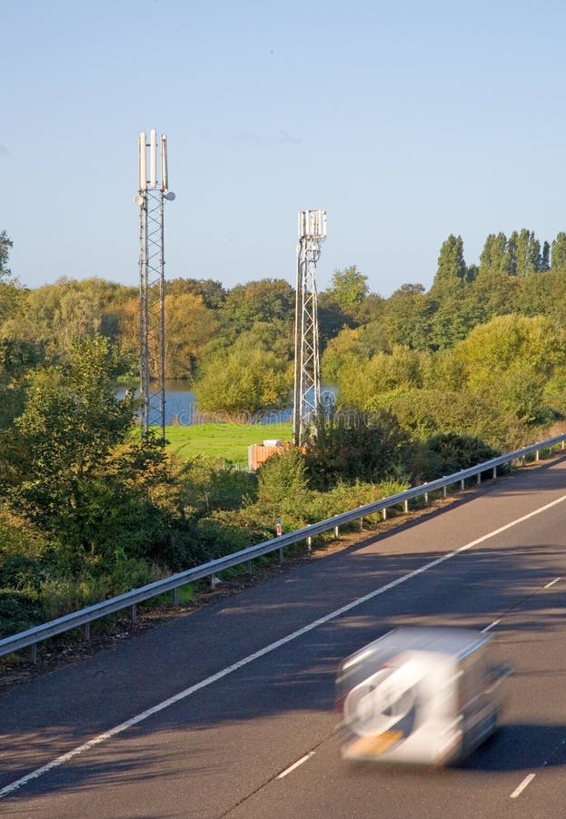 Cell phone antenna towers used for GSM and 3G by a motorway (M3) in the UK near Shepperton. Cell phone antenna towers used for GSM and 3G by a motorway (M3) in the UK near Shepperton