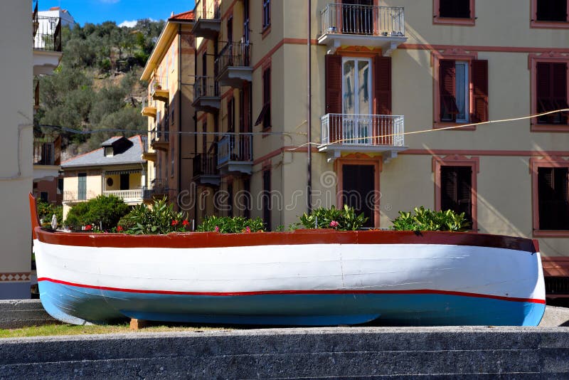 typical Ligurian boat used as a planter celle Ligure Italy