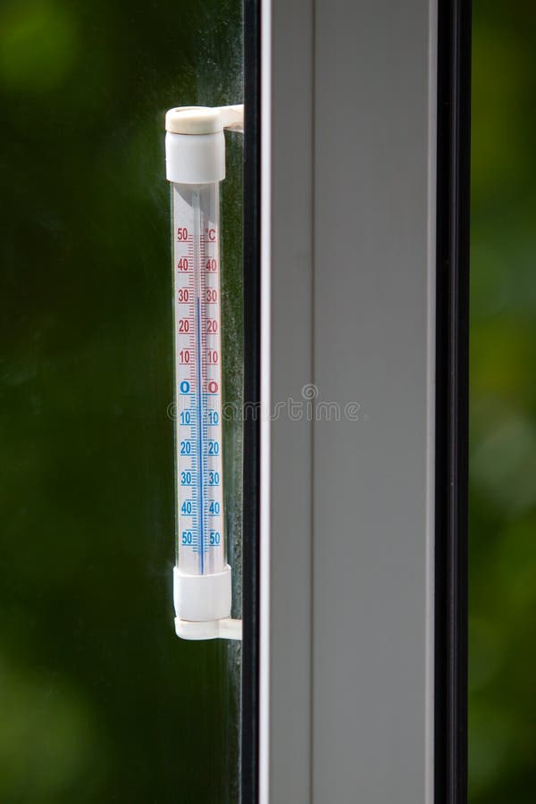 Thermometer Outside The Window Shows Very High Temperature Stock