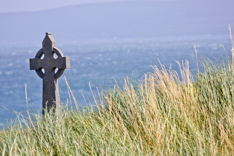 Celtic cross in a field in Inisheer, Ireland