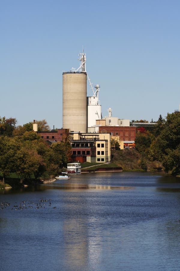 Cement factory near river stock photo. Image of river - 3157192
