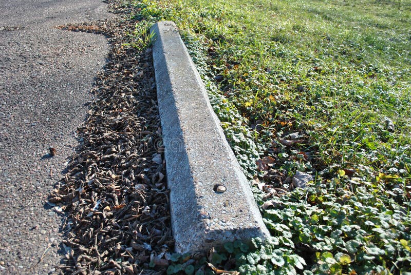 Cement Parking Marker stock photo. Image of grass, parking - 63479796