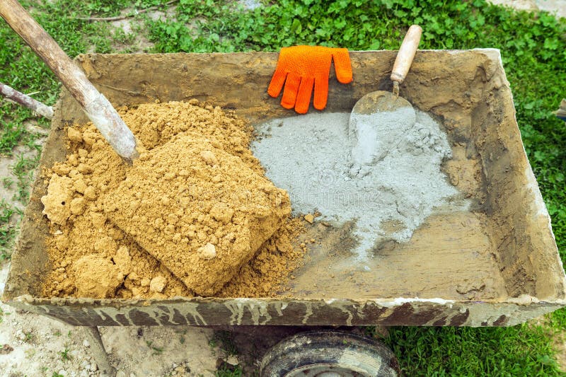 Cement with Sand and Tools for Builder in Cart. Preparation for Mixing