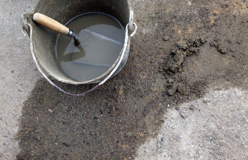 Cement trowel in bucket stock image. Image of down, containing 10896645
