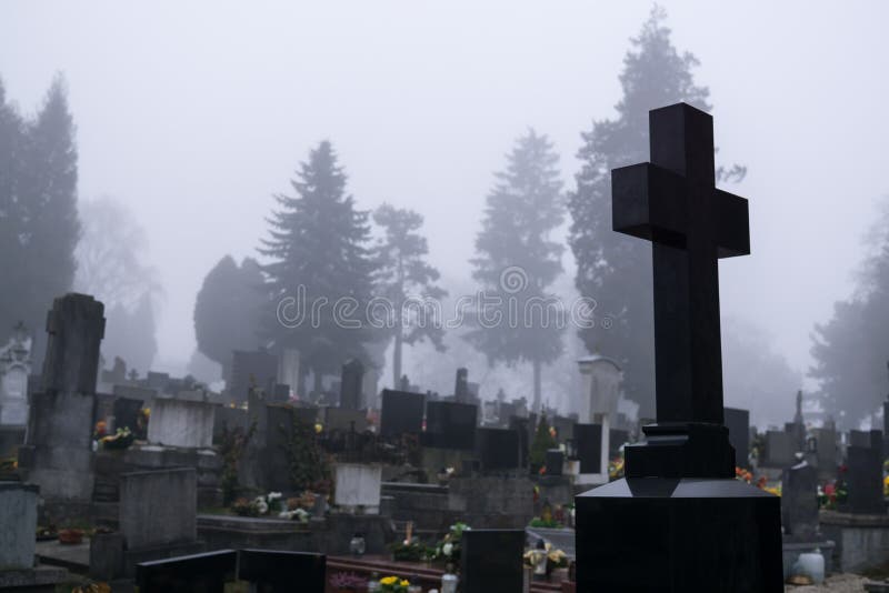 Cemetery with graves  during dark misty morning or night. Slovakia. Cemetery with graves  during dark misty morning or night. Slovakia