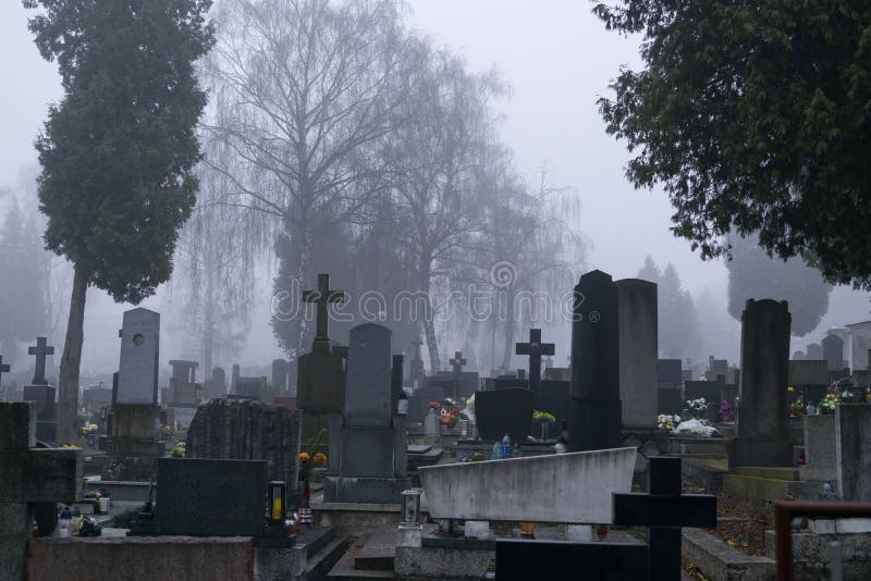 Cemetery with graves  during dark misty morning or night. Slovakia. Cemetery with graves  during dark misty morning or night. Slovakia