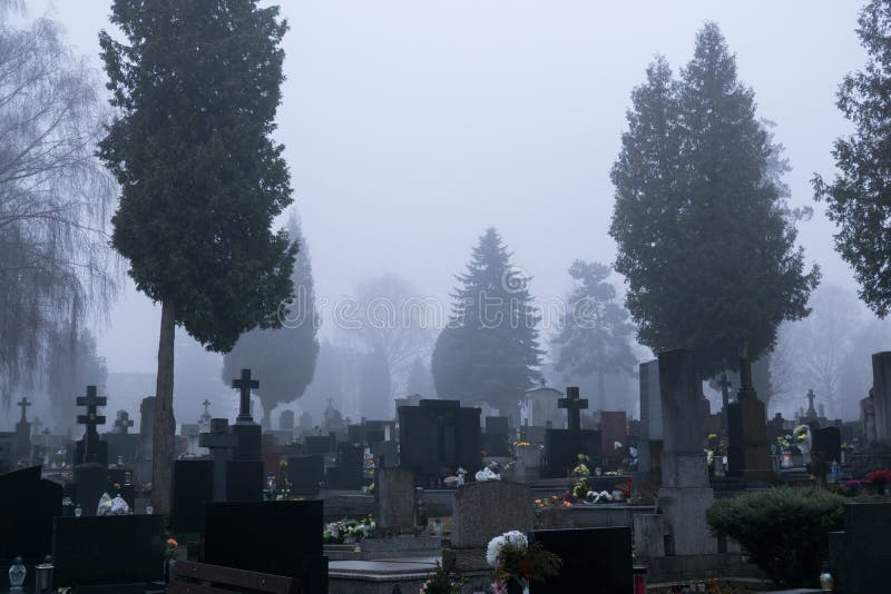 Cemetery with graves  during dark misty morning or night. Slovakia. Cemetery with graves  during dark misty morning or night. Slovakia