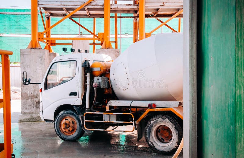 Cement truck of cement batching plant factory at loading area. Cement truck of cement batching plant factory at loading area