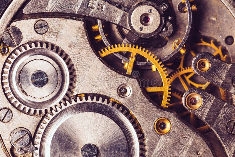 Cenni storici del movimento a orologeria Vecchio meccanismo dell'orologio di orologio Retro movimento a orologeria fotografia stock Cenni storici del movimento a orologeria Vecchio meccanismo dell'orologio di orologio Retro movimento a orologeria fotografia stock