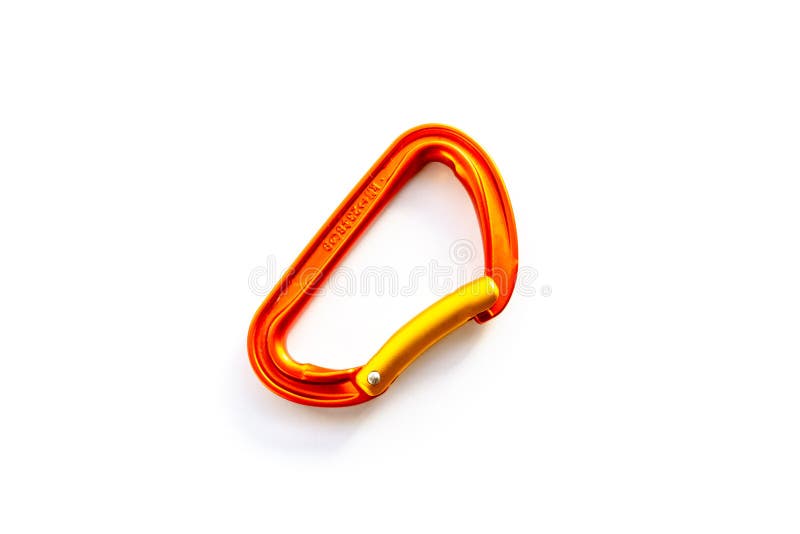 Centered orange solid bent gate carabiner karabiner used for clipping the rope in, isolated on white background, with copy space stock photography