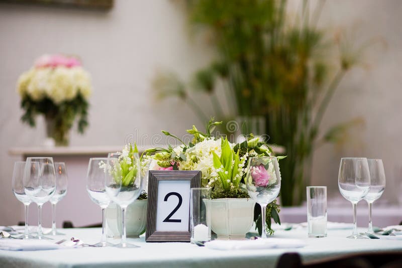 Centerpieces on a table stock image. Image of dining 59109773