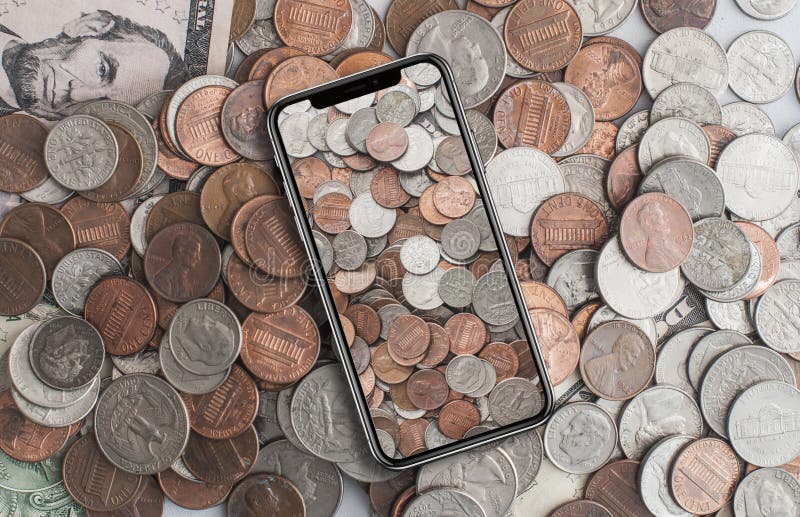 Centesimi americani sul telefono cellulare immagini stock libere da diritti Centesimi americani sul telefono cellulare immagini stock libere da diritti