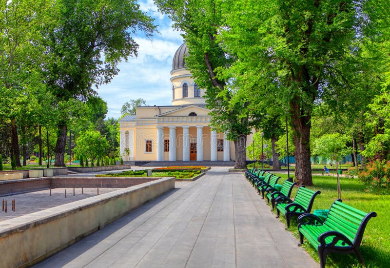 Central park and cathedral in Chisinau , pedestrian pavement and benches in the city park. Central park and cathedral in Chisinau , pedestrian pavement and benches in the city park